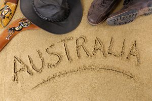 Australia outback or beach background with boomerang bush hat and boots.