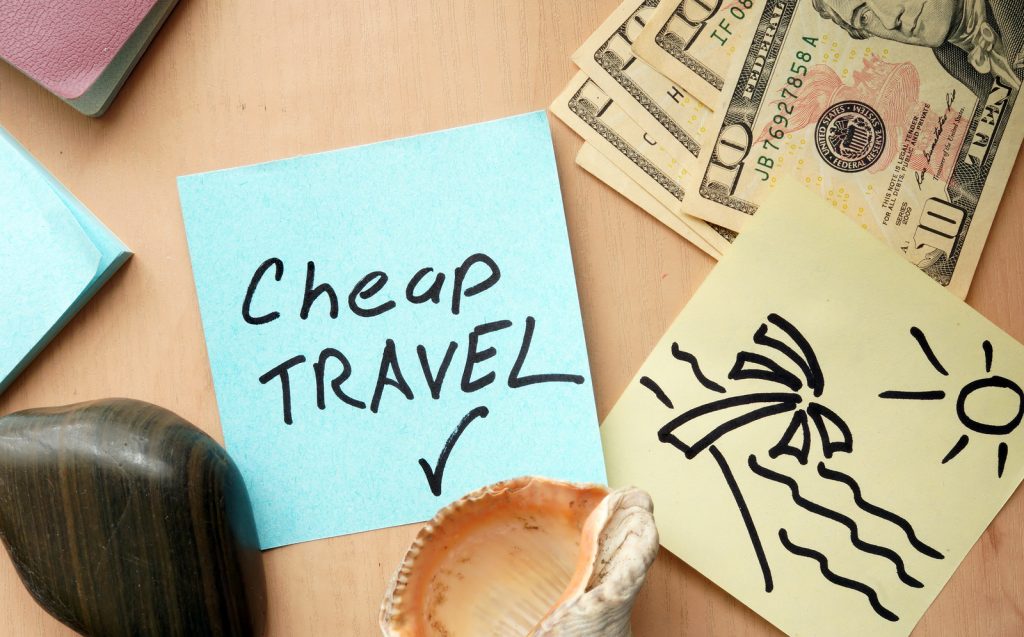 Cheap travel paper on a table with money. travel and tourism concept.